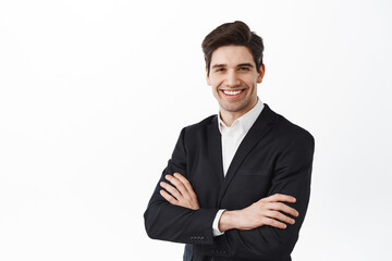 Determined company owner, businessman in suit cross arms on chest, standing power pose, smiling...