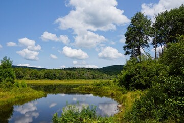 Fototapeta na wymiar Clouds reflected in a lake in the Catskill Mountains in Upstate New York