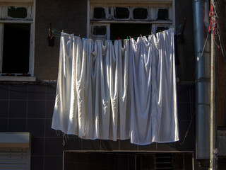 white clothes hanging on the street