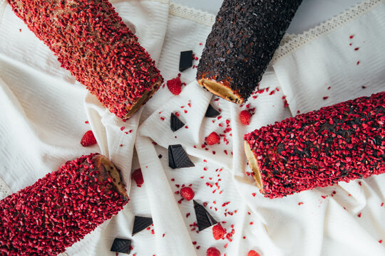 Group photo of new Kurtos Kalacs, traditional Hungarian food, also known as chimney cake with amazing raspberry, chocolate and cinnamon flavors. 