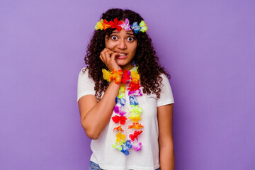 Young Hawaiian woman isolated on purple background biting fingernails, nervous and very anxious.