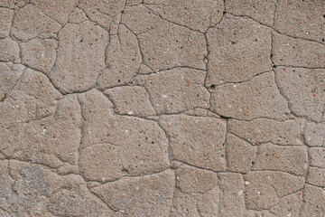 cracked old gray limestone wall