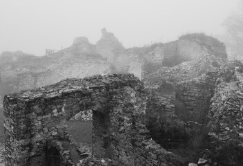 castle ruins covered in fog