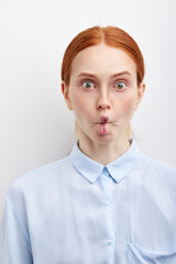 Comic Redhead Female In Formal Shirt Makes Funny Faces