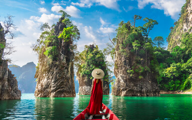 Woman traveler on boat joy nature view rock island scenic landscape Khao Sok National Park, Famous...