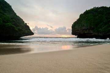 Fototapeta na wymiar Dusk view in the beach. Greweng Beach, Gunung Kidul Regency, Yogyakarta, Indonesia.