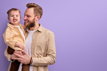 Bearded Caucasian Daddy Playing With Son, Children and Family Concept