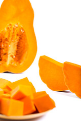 Orange cutted pumpkin pieces. Sliced pumpkin isolated on a white.
