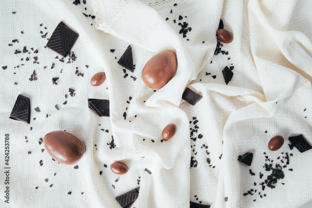 Canvas Prints Chocolate Easter eggs on a rustic tablecloth. 