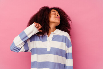 Young african american woman isolated on pink background showing a dislike gesture, thumbs down. Disagreement concept.