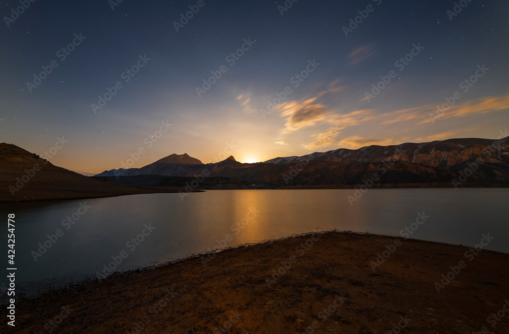 Wall mural moon rise in the mountains. beautiful night ladnscape lake and mountais, reflection in the water in 