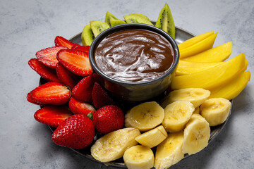 Dish of Fruits with chocolate ready to eat take away