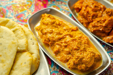Chicken Madras and Chicken Tikka Masala with Pilau Rice, Naan Breads and, Onion Bhajis