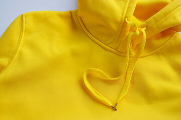 Yellow hoodie close-up.