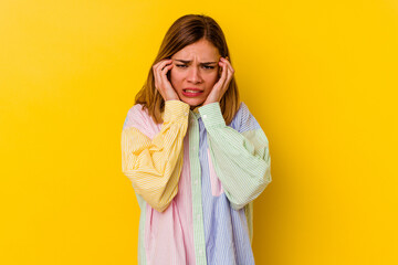 Young caucasian skinny woman isolated on yellow background crying, unhappy with something, agony and confusion concept.