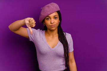 Young african american woman isolated on yellow background Young african american woman isolated on yellow background showing thumb down, disappointment concept.