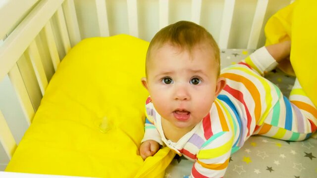 baby plays in the crib. selective focus.
