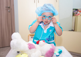 A boy with Down's syndrome plays a role-playing game, a genetically ill disabled child dressed as a...