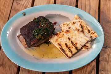 grilled ribs with pita bread, a dish from the restaurant