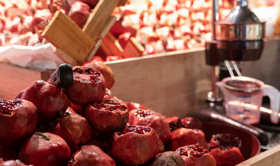 fresh pomegranates on the counter for making fresh juice