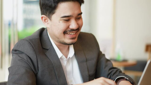 slow motion scene of middle eastern businessman video conference with marketing team to talk and explaining about market research  ouse for technology concept
