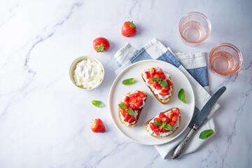 Strawberry ricotta sandwiches with mint leaves