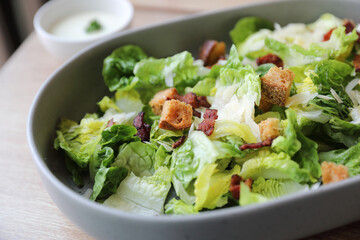 caesar salad appetizer on wooden background