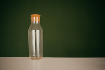 glass bottle with a wide neck and a large cork cap
