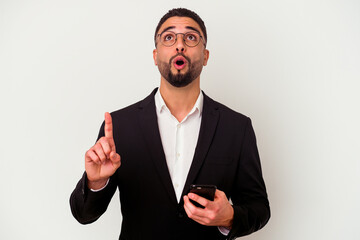Young mixed race business man holding a mobile phone man isolated on white background