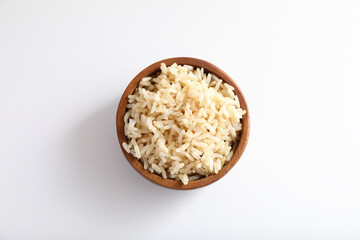 Organic boiled brown rice on bowl in close up