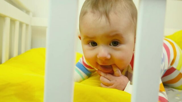 baby plays in the crib. selective focus.