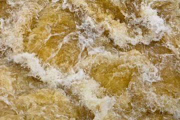 Water turbulent flowing out of the weir