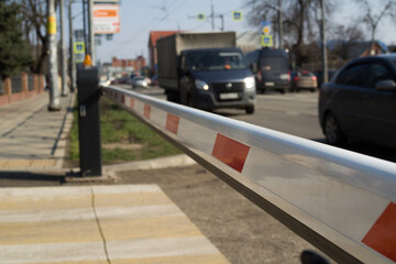 The barrier close the road. loses the passage for cars. Traffic forbidden road sign on a main road.Protected area, entrance is prohibited, passage