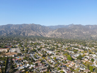Aerial view above Pasadena neighborhood with mountain in the background. northeast of downtown Los Angeles, California, USA