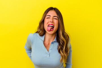 Fototapeta premium Young caucasian woman isolated on yellow background