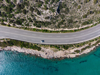 Aerial top down view of the road at Karamanli's Hole area in Agia Marina, Koropi