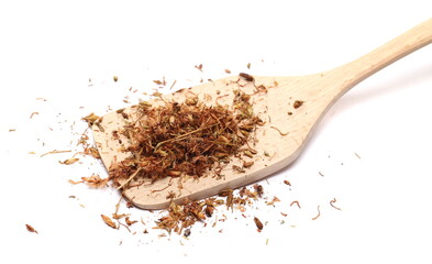 Dry St. John's wort pile in wooden spoon (Hypericum perforatum) isolated on white background 