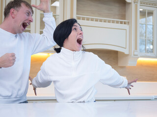 Couple in love. Kitchen couple. Happy day. Emotion. Fun. 