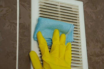 A layer of dust on the ventilation grate.Dust is wiped with a cloth