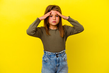 Little caucasian girl isolated on yellow background receiving a pleasant surprise, excited and...
