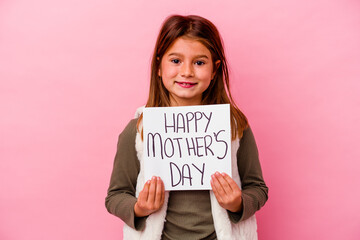 Little girl holding a happy mothers day banner isolated on pink background