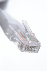 network LAN cable white with a connector rj 45. close-up.