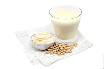 Soy milk and soybean mayonnaise with beans on napkin.