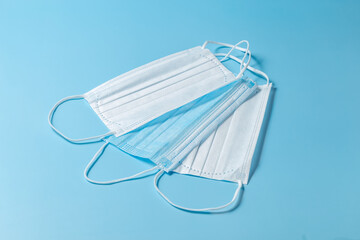 Surgical masks on a blue background. Close-up. Medical concept.