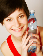 woman with bottle of clean water