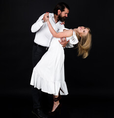 Dancing, Salsa, Tango. Young elegant tango dancers. Couple dancing waltz. Ballroom.