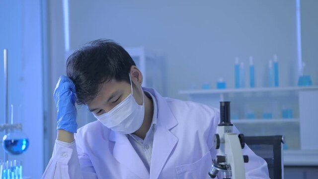 Research concept of 4k resolution. Asian scientists are in trouble in the experiment.