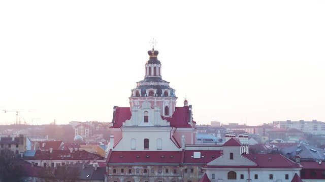 Beautiful drone footage of Vilnius Old Town during sunset. Aerial wide shot,