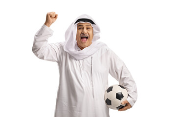 Happy mature arab man with a soccer ball cheering