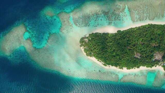 Aerial view of a tropical island in the Indian Ocean. Thinadhoo (Vaavu Atoll), Maldives